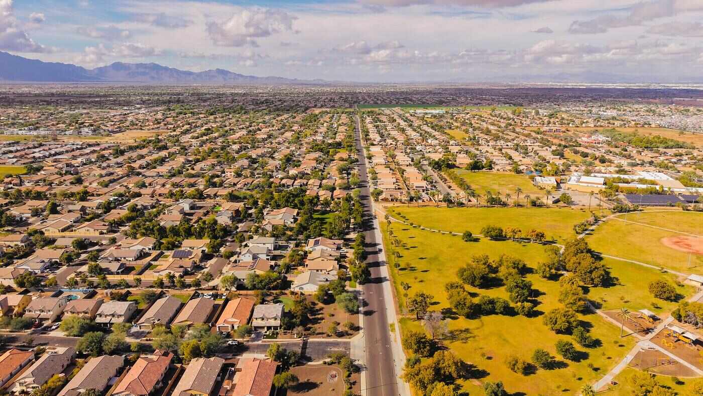 Aerial view of a newer west Valley subdivision under a bright sky